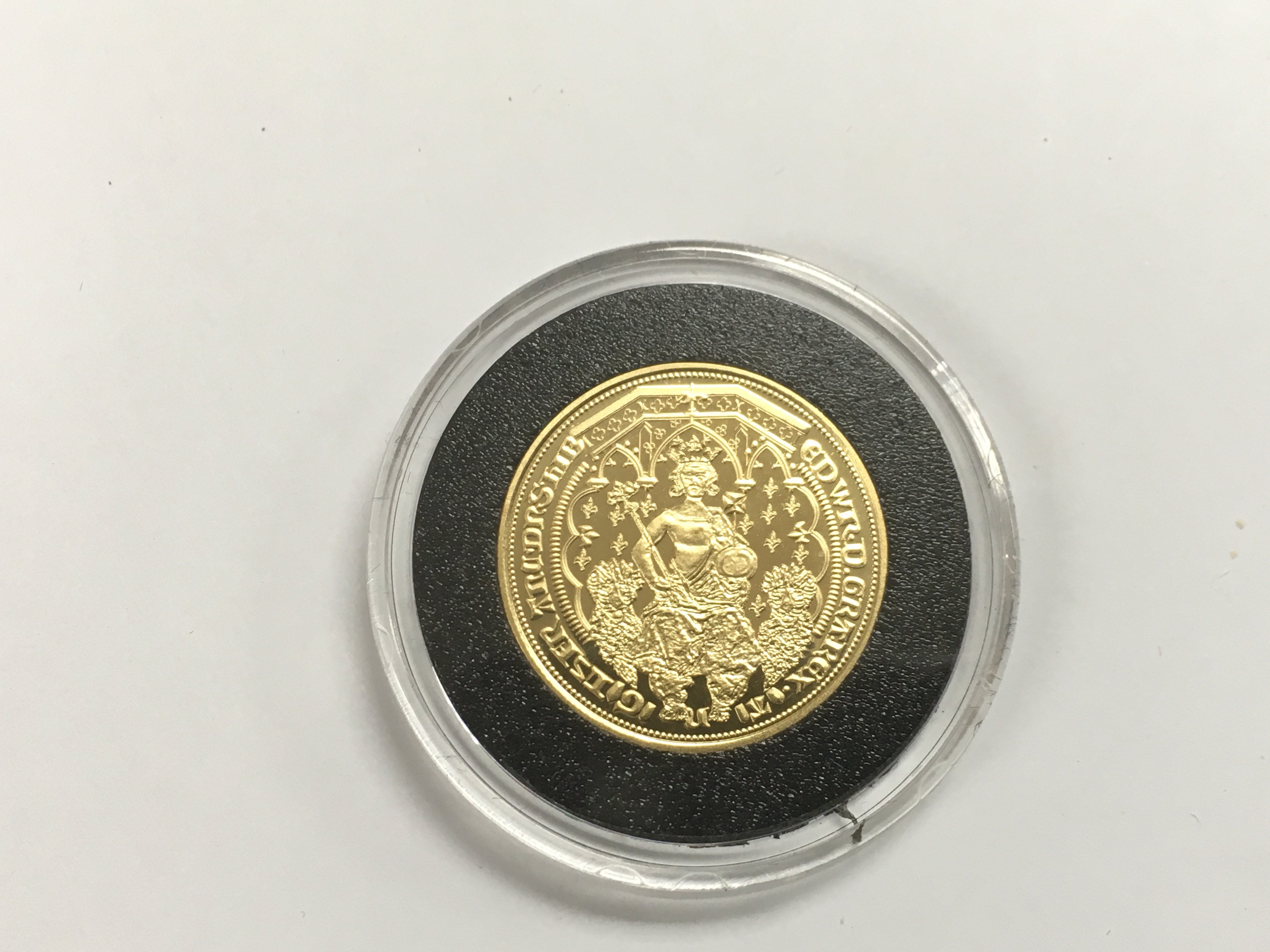 A gold proof double leopard coin from the Millionaires collection with COA.