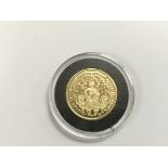 A gold proof double leopard coin from the Millionaires collection with COA.