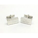 A pair of Gucci silver cufflinks.