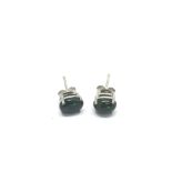 A pair of silver studs set with black Ethiopian op