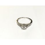 A very modern style diamond ring with diamond shou