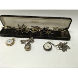 A Collection of watch keys and three miniature wat