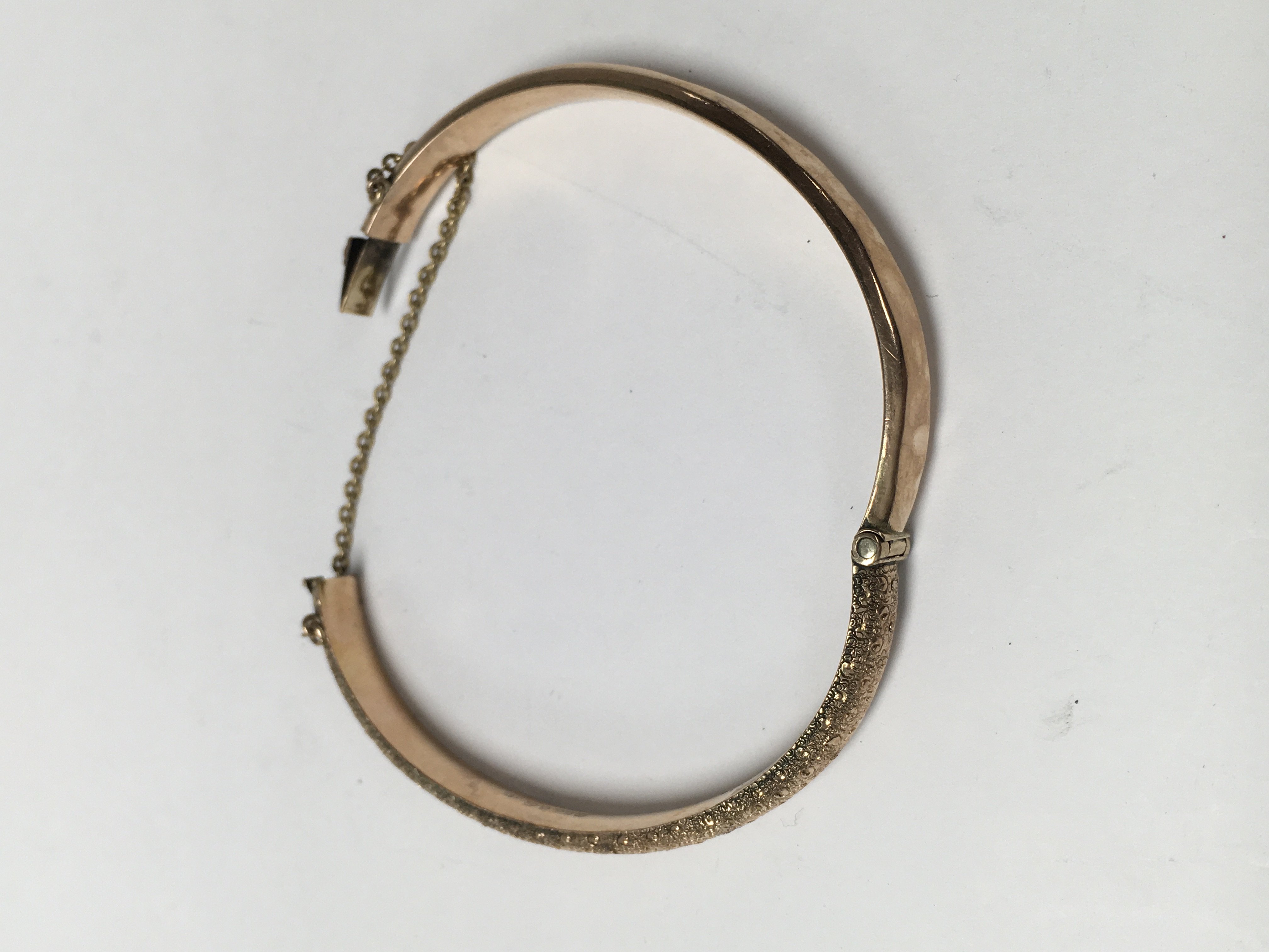 A gold bangle 7 .4 grams