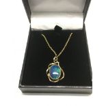 A 9ct gold opal pendant suspended on a 9ct gold ch