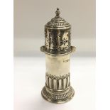 A silver lighthouse sugar caster, London hallmarks.