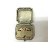 An 18carat gold ring set with a small diamond approximately 0.20 of a carat.weight 3.7g ring size