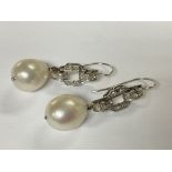 A pair of Platinum diamond and pearl drop earrings
