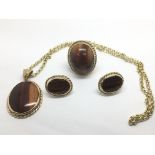 A collection of 9ct gold and tiger's eye jewellery