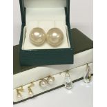 A Pair of 9ct large pearl earrings together with T
