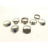 A collection of eight vintage silver rings most wi