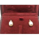 A pair of 9ct gold pearl and diamond bale drop ear