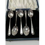 Five bright cut silver spoons, cased. Weighing altogether approximately 52g - NO RESERVE