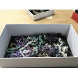 A box containing a quantity of rock crystal amethyst and other stone necklaces. (a lot)