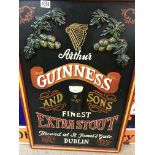 A Guinness advertising sign on board . 90 by 60 cm