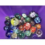 A collection of paperweights various.