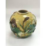 A small Chinese vase with applied decoration of a stork anongst foliage, approx height 10.5cm.