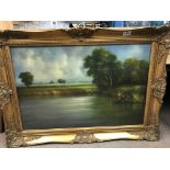 A framed landscape scene, with a girl painted looking at a lake View. Signed by the artist appearing