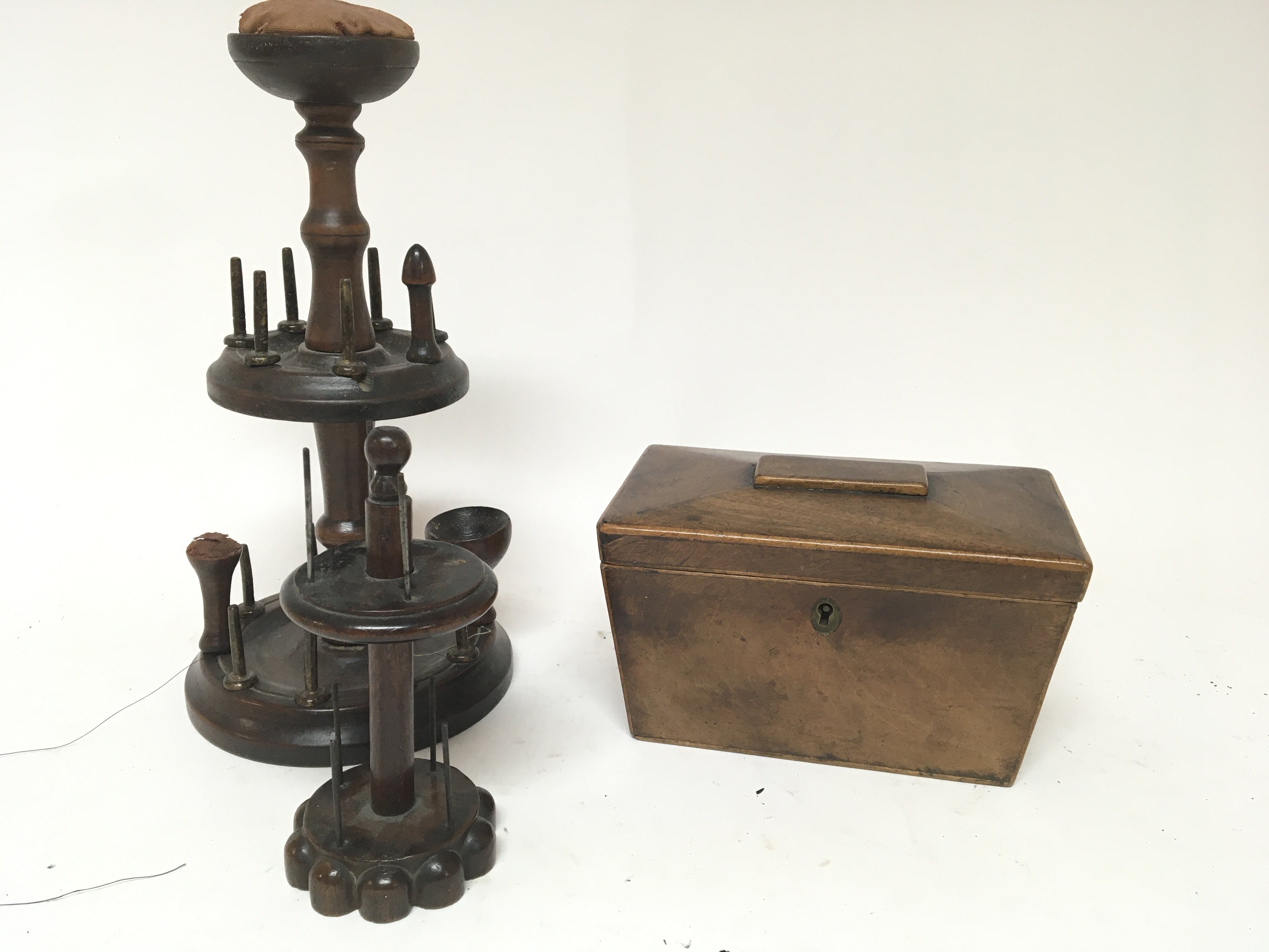 A 19th century treen bobbin holder and a 19th century tea caddy (2)