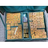 A vintage leather cased mahjong set.