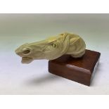 A 19thC carved Ivory handle in the form of a horses head.