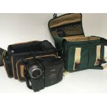 A collection of camera equipment camera bags accessories including a Sharp viewcam Hi-Fi VL-H400 and