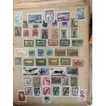 A vintage stamp album and contents.