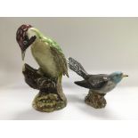 Two Beswick figures of birds comprising a Woodpeck