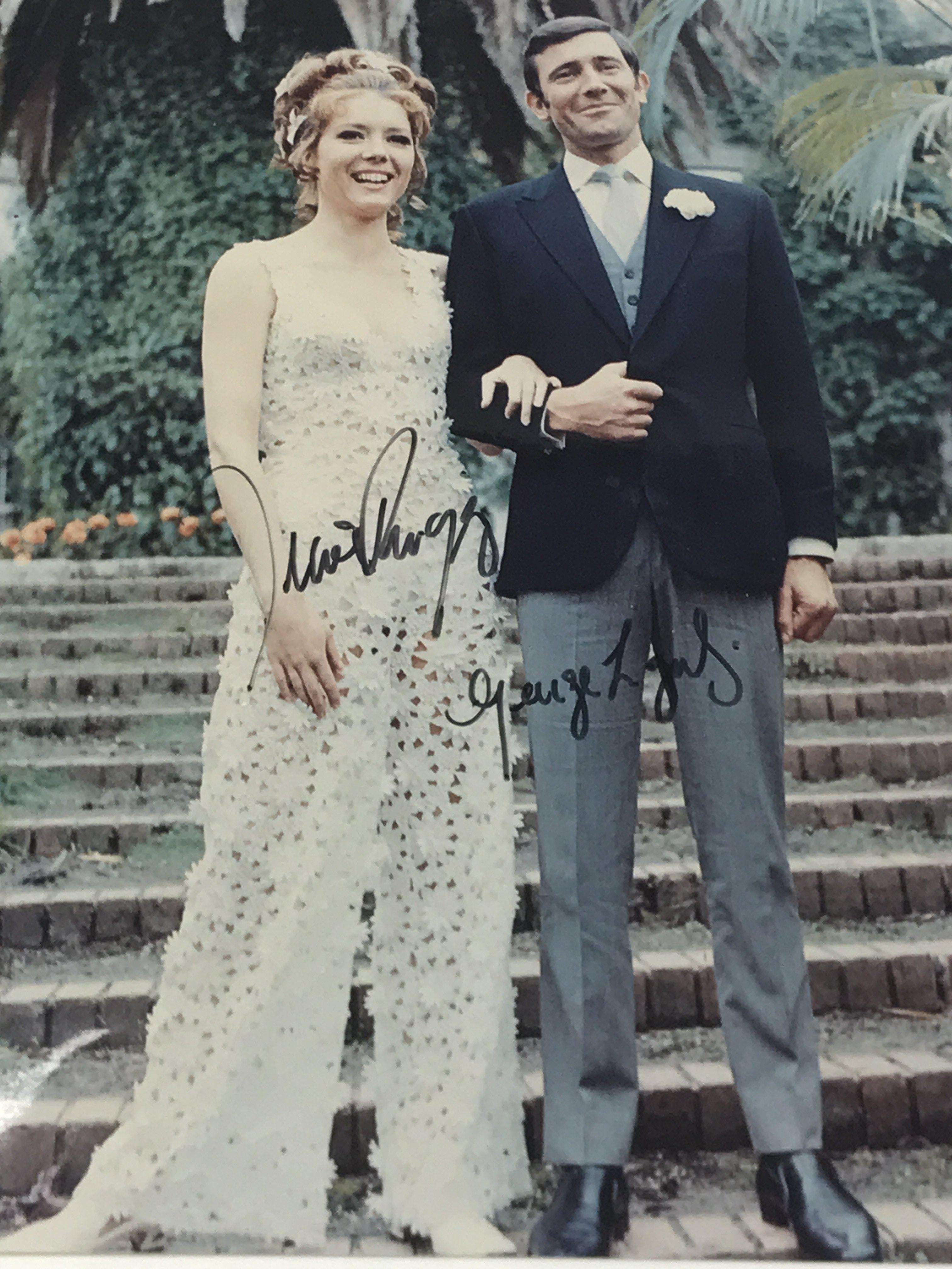 A signed photograph of Diana Rigg and George Lazenby together with The Official James Bind Movie Boo - Image 2 of 2