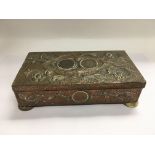 An Arts and Crafts copper card box inset with coin