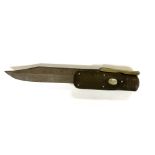 An antique folding Bowie knife with leather sheath