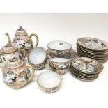 A Japanese eggshell tea set decorated with figures and applied gilt (a lot) - NO RESERVE