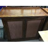 A walnut chiffonier with linen panel fronts.