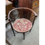 An Edwardian inlaid circular corner chair.