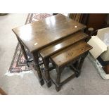 A nest of three oak tables plus one other nest of three with a quarter veneered top - NO RESERVE