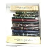 A collection of fountain pens including Conway Ste