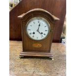 An inlaid Edwardian mantle clock together with an