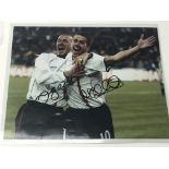 A signed photograph of David Beckham and Michael O