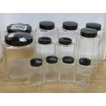 A collection of German Remmler 1940s Chemist/Beautician glass bottles with black Bakelite lids (