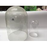 Two old glass domes height 48cm and 27cm (2) no ob