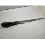 An piece of Shrapnel from the Romford Blitz 1940 turned into a paperknife.