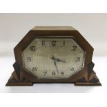 An Art Deco mantle clock with key, approx width 24cm.