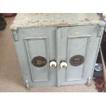 An old two door safe with key 69cm wide 49cm deep