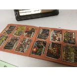 A Vintage album of ABC picture cards adventure and battle cards.