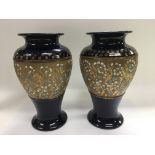 A pair of Doulton vases with giltwork decoration o