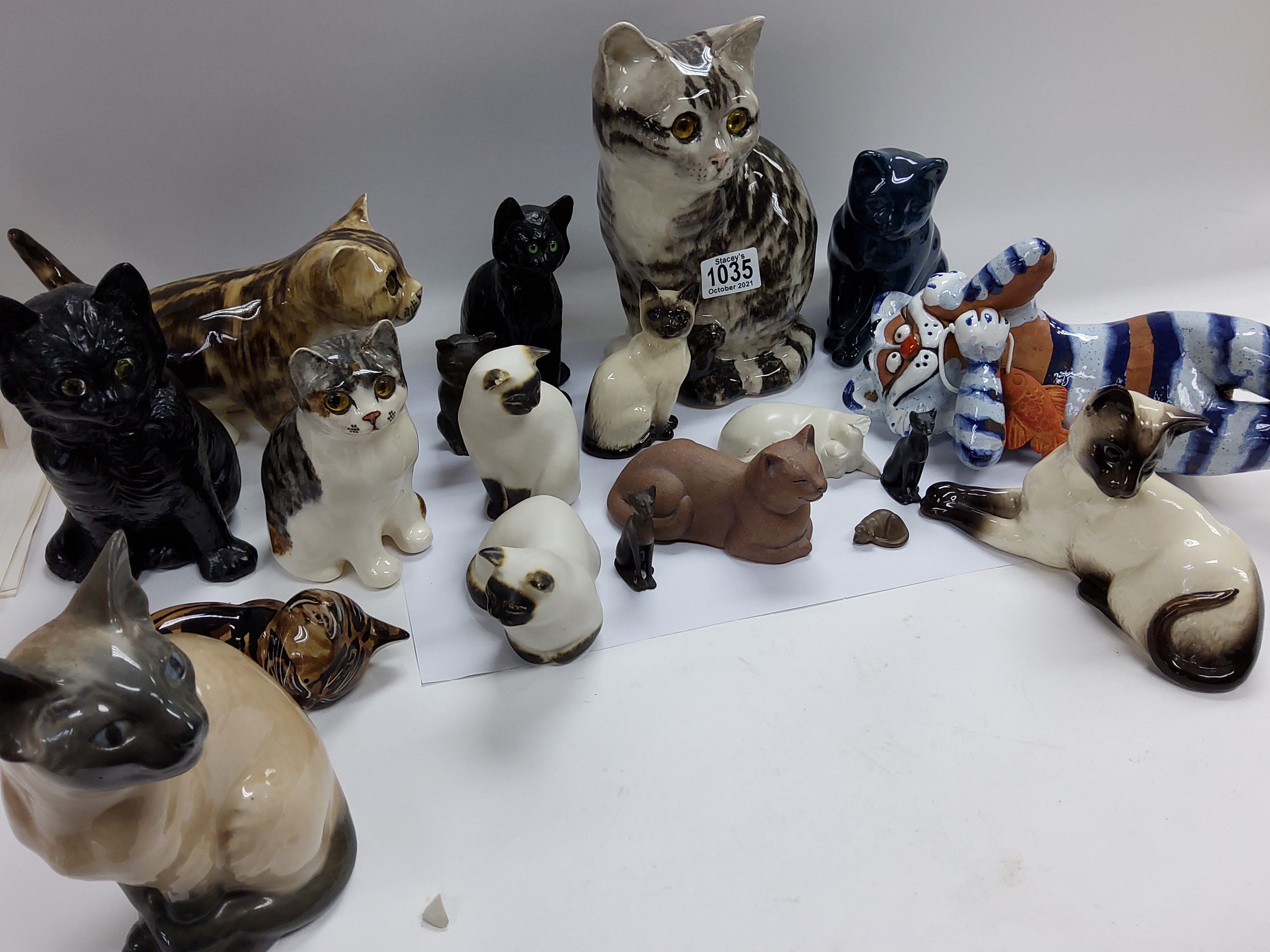 A collection of Winterton cats and other ceramic c
