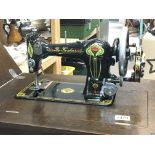 A Vintage manual wind British made sewing machine nicely decorated of Art Nouveau design in a