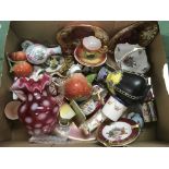 A box of glassware and ceramic items including a cranberry jug, crested ware bud vase of Southend