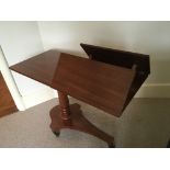 A Victorian Mahogany bedside adjustable reading table with brass fittings.