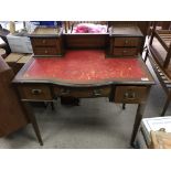 An Edwardian inlaid mahogany desk. Measuring approximately in height 88cm. The table top measures