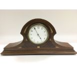 An Edwardian inlaid mahogany mantle clock.